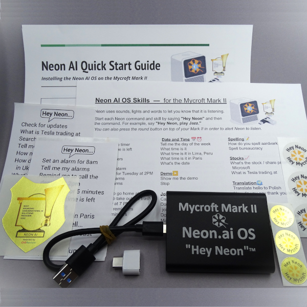 Neon SSD Boot drive, instructions, stickers, cord, and reusable adhesive fastener to attach the SSD to the Mark II